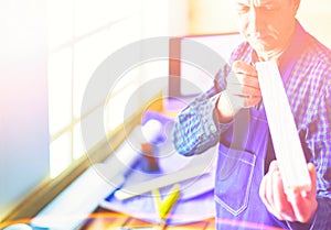 Architect working on drawing table in office