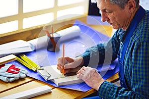 Architect working on drawing table in office