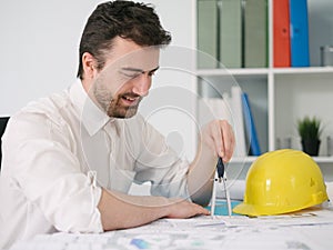 Architect working on his projects papers