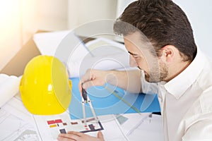 Architect working on his projects papers