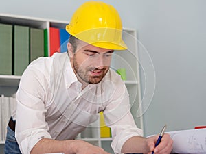 Architect working on his projects papers