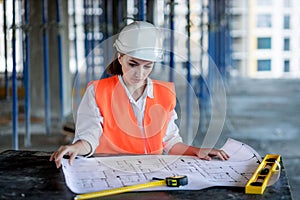 Architect working over plan. Closeup Desk With blueprints drawing