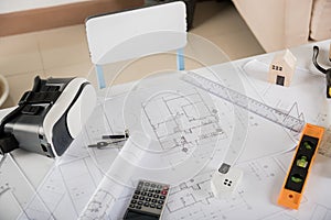 Architect workplace top view. Architectural blueprint paper project plans on desk table