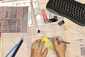 Architect workplace top view. Architectural project, blueprints, blueprint rolls on table. Construction background. Engineering to