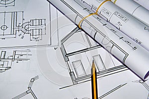 Architect workplace top view. Architectural project, blueprints, blueprint rolls on table. Construction background. Engineering