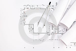 Architect workspace with blueprints and drawing compass