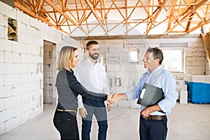 Architects and civil engineer at the construction site.