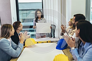 Architects, designers and engineers having working meeting in modern office
