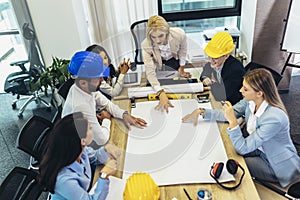 Architects, designers and engineers having working meeting in the office