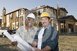 Architects In Front Of Incomplete House