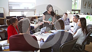 Architects Meeting At Table To Discuss Materials