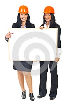 Architects women holding banner
