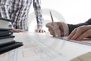 Architects working on blueprint, real estate project. Architect workplace - architectural project, blueprints, ruler