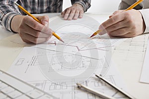 Architects working on blueprint, real estate project. Architect workplace. Construction concept. Engineering tools.