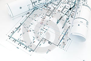 Architects workplace with project plans and drawing compass