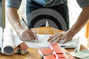 Architects write home designs on the desk photo