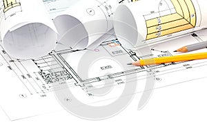 Architectural background with blueprint, rolls and pencils