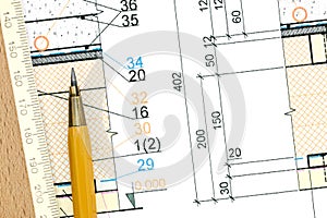 Architectural blueprint fragment with pencil and ruler