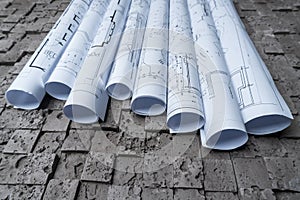 Architectural blueprints on grey wall backround