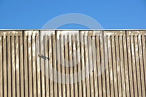 Architectural close up of an industrial facade building with metallic panels