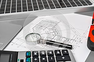 Architectural construction plans paper on table close up