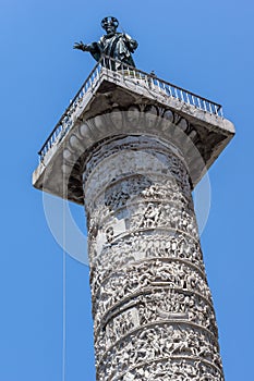 Architectural detail from ancient Marcus Aurelius Column in front of Palazzo Chigi in city of Rome, Italy