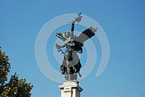 Architectural detail of Baroque bronze statue in Rome.
