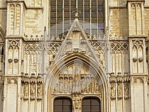 Architectural detail of Brussels Cathedral with arch and statues of saints