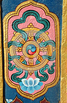 Architectural detail of buddhist monastery - dharma wheel photo