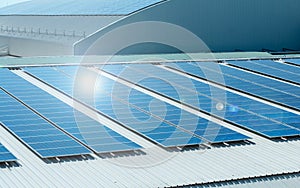 Architectural detail of metal roofing on commercial construction Solar panels or Solar cells on factory rooftop or terrace with su