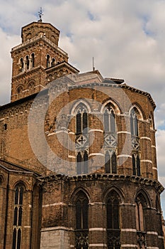 Architectural detail of an old brick church with gothic windows in Venice, Italy