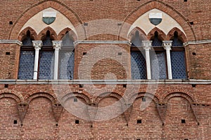 Architectural detail of the Palazzo Pubblico at the Piazza del Campo in Siena, Italy, Europe