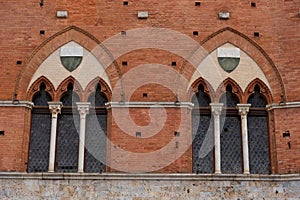 Architectural detail of the Palazzo Pubblico at the Piazza del Campo in Siena, Italy, Europe