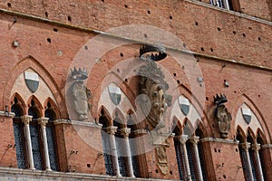 Architectural detail of the Palazzo Pubblico at the Piazza del Campo in Siena, Italy, Europe