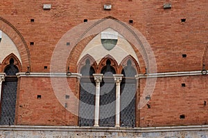 Architectural detail of the Palazzo Pubblico at the Piazza del Campo in Siena, Italy, Europe