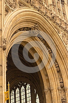 Architectural detail of the royal entrance below the Victoria Tower at the British Parliament building in London, England.
