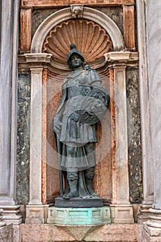 Architectural detail, a sculpture adorns the entrance to the Campanile di San Marco -bell tower of Saint Mark- Italy.