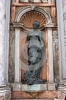 Architectural detail, a sculpture adorns the entrance to the Campanile di San Marco -bell tower of Saint Mark- Italy.