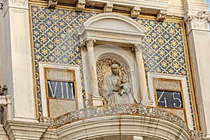 Architectural detail on Torre dell Orologio In San Marco Square Of Venice, Italy photo