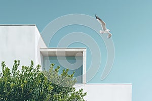 Architectural detail of white modern Mediterranean house in blue sky background. Minimal architecture building detail in