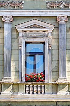 Architectural detail with the windows of an old building. Old vintage architecture in the center of Brasov, Romania