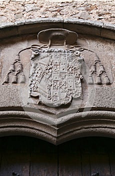 Architectural details and blazonry on the wall of The Episcopal Palace in Caceres photo