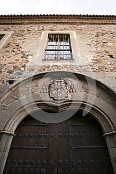 Architectural details and blazonry on the wall of The Episcopal Palace in Caceres