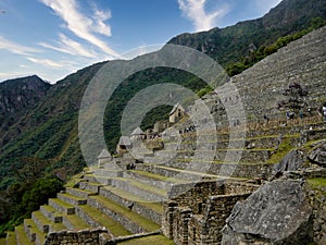 Architectural details of the characteristic steps of the wonderful and ancient Inca city of Machu Picchu in Peru