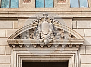 Architectural details, elaborate arch over a door photo