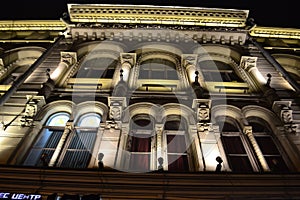 Architectural details of a historic building with lighting