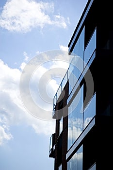 Architectural details of modern apartment building with reflections.