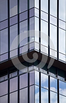 Architectural details of modern office building with reflections