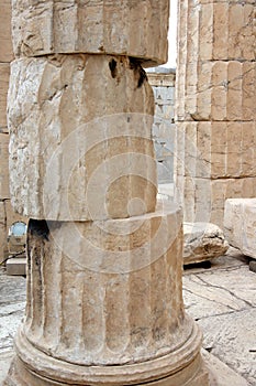 Architectural details, shifted faceted stone blocks of a column at the base, on Acropolis, Athens, Greece