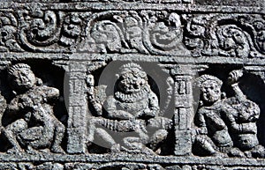 Architectural details of stone carvings in ancient Hindu Temple photo